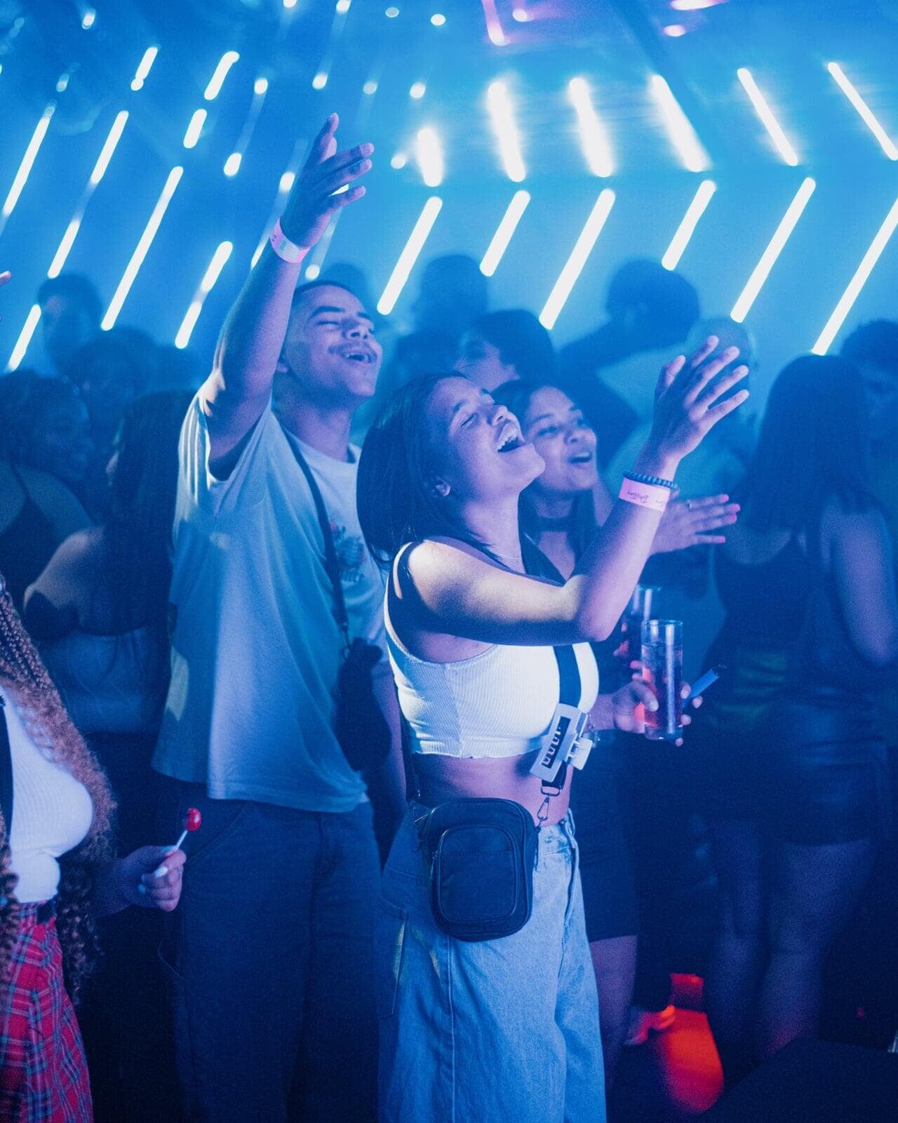 Image of party goers singing along to the music