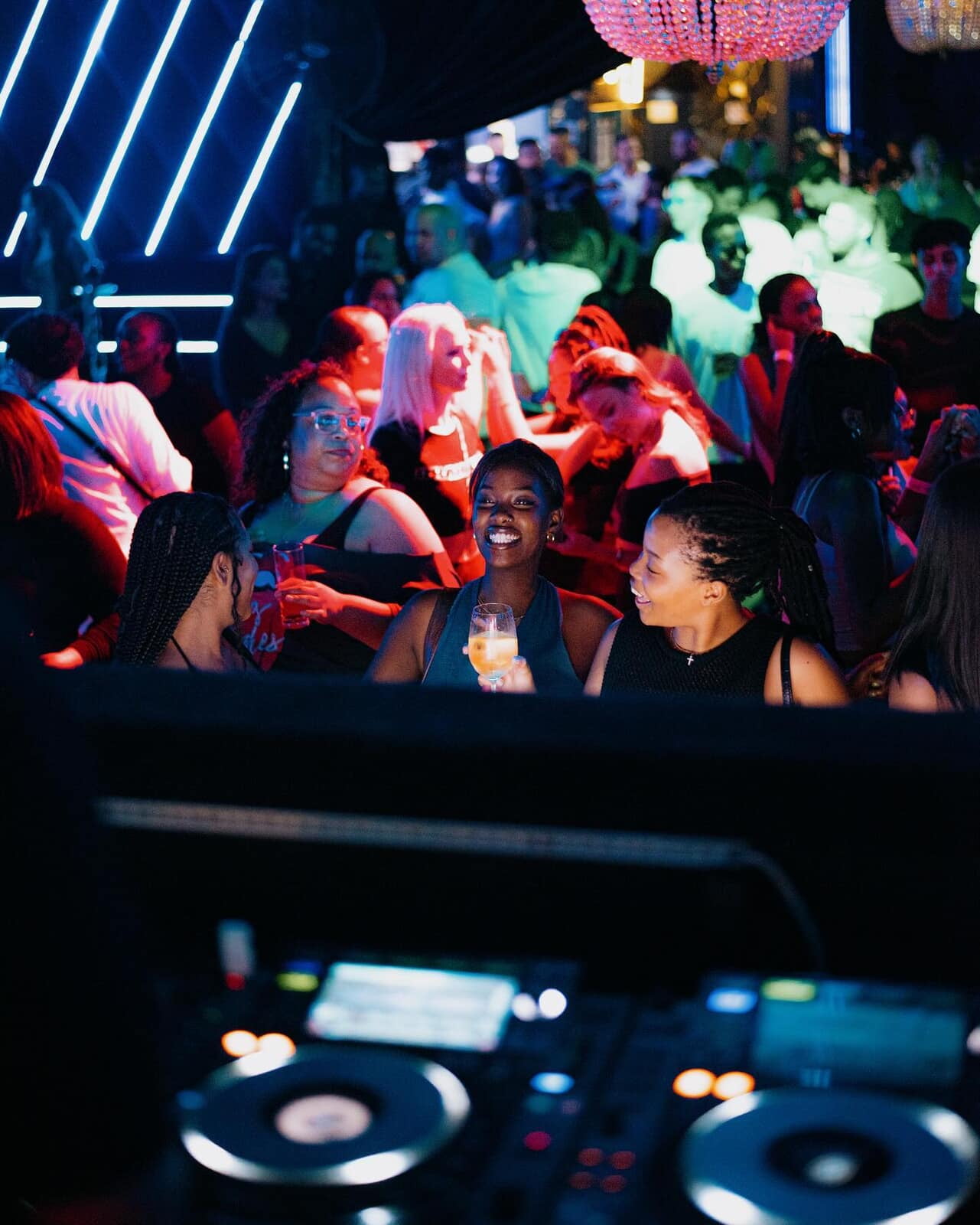 Image of crowd in front of DJ booth
