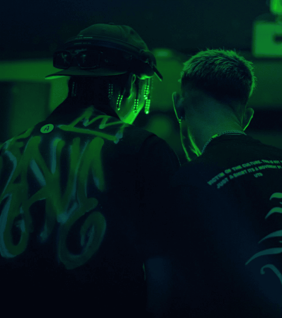 Image of 2 Dj's backs while they DJ